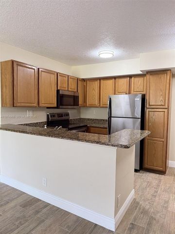 811 Lyons Rd 20104, Coconut Creek, FL 33063