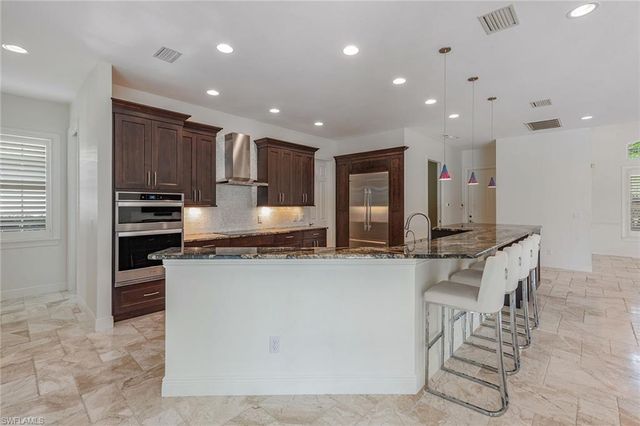 571 Eagle Creek DR, Naples, FL 34113