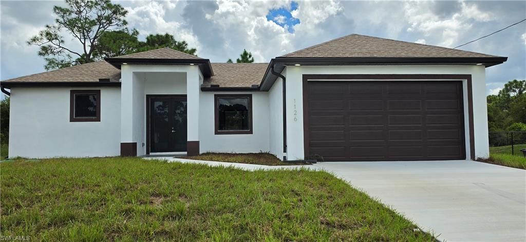 1126 Milwaukee BLVD, LEHIGH ACRES, FL 33974 — exterior