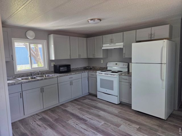 101 Larch Dr, Log Lane Village, CO 80705
