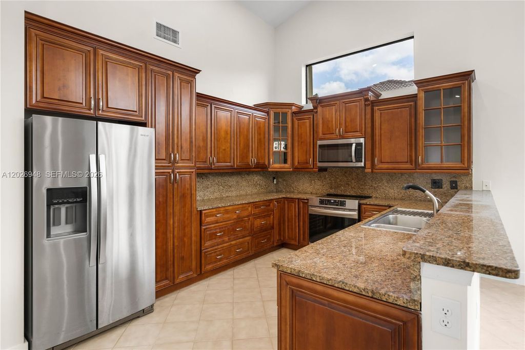 Image 26 of property listing at 1087 Deerwood Ln, Weston, FL 33326