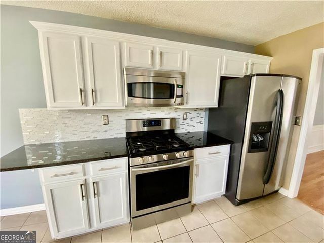 9020 Friarbridge Drive, Suwanee, GA 30024