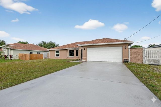 557 SW Halkell Avenue, Port St. Lucie, FL 34953