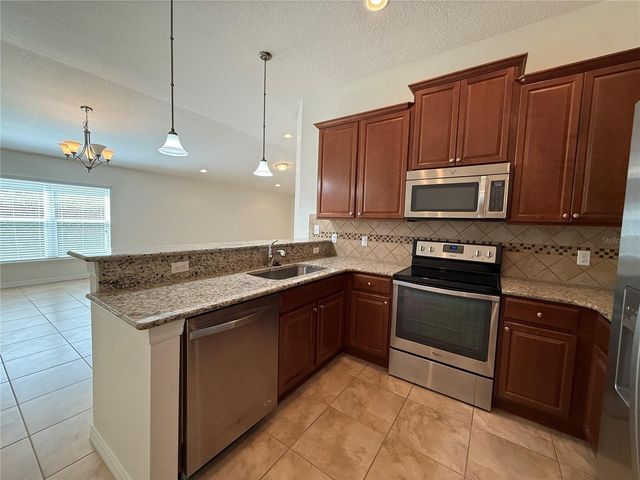 12108 TRIPLETAIL LANE, Orlando, FL 32827