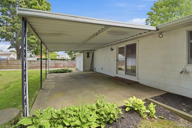 6 Budenos Drive, Sayville, NY 11782