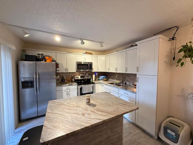 1021 Springdale Circle, Palm Springs, FL 33461