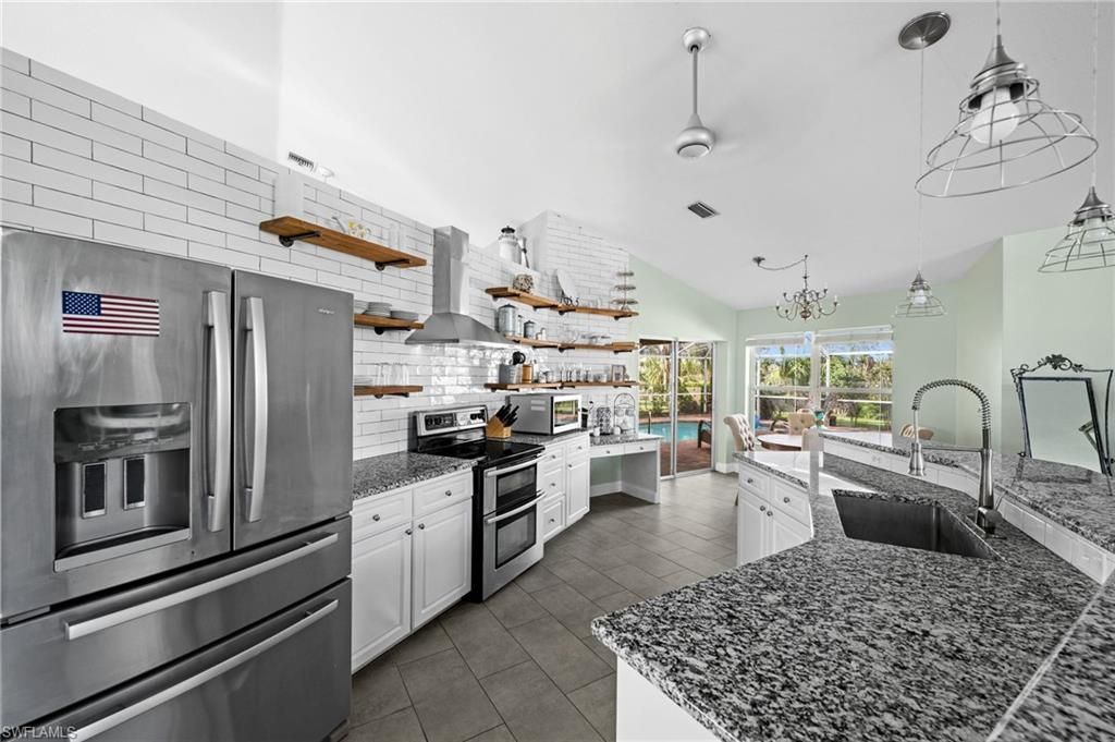 Image 4 of property listing at 411 SE 17th ST, Cape Coral, FL 33990