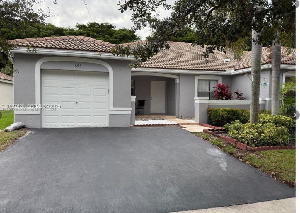 Image 24 of property listing at 1653 Zenith Way, Weston, FL 33327