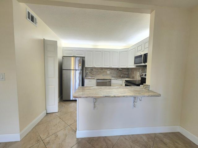 310 Knotty Pine Circle A-1, Greenacres, FL 33463