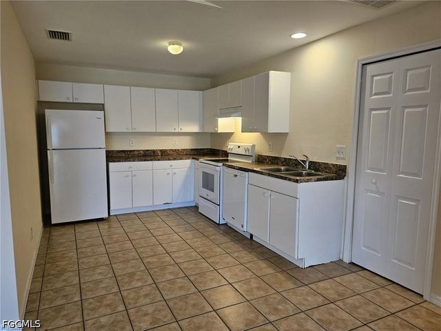 713 Jenna AVE S, Lehigh Acres, FL 33973