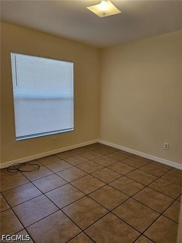 713 Jenna AVE S, Lehigh Acres, FL 33973