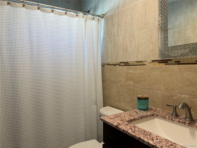 65 Morning Glory Road, Levittown, NY 11756