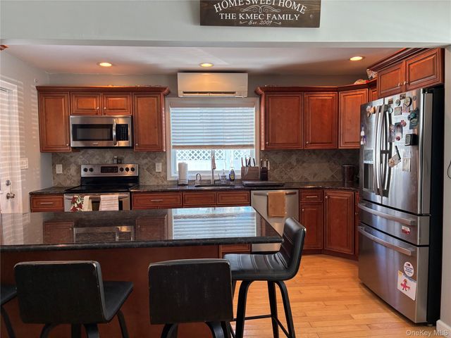 65 Morning Glory Road, Levittown, NY 11756