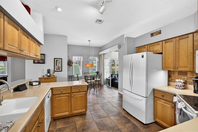 5036 SAWGRASS LAKE CIRCLE, Leesburg, FL 34748