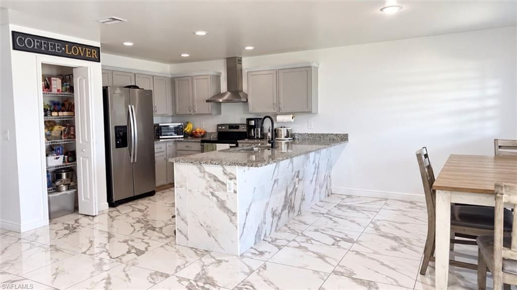 1010 NE 1st AVE, CAPE CORAL, FL 33909 — photo 2