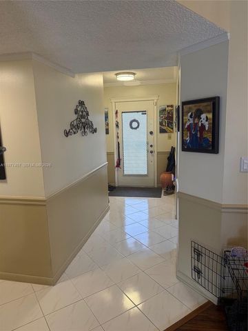 4940 E Sabal Palm Boulevard 203, Tamarac, FL 33319