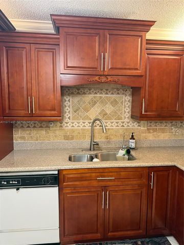 4940 E Sabal Palm Boulevard 203, Tamarac, FL 33319