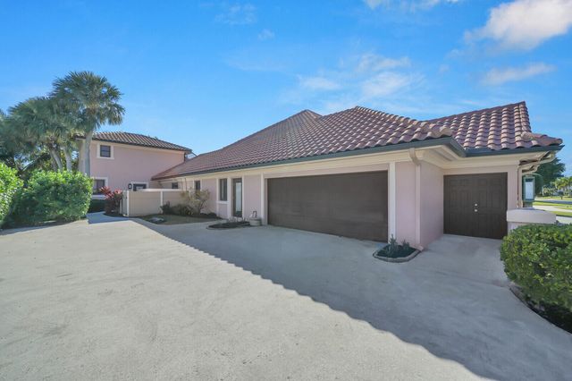 513 N Country Club Drive, Atlantis, FL 33462