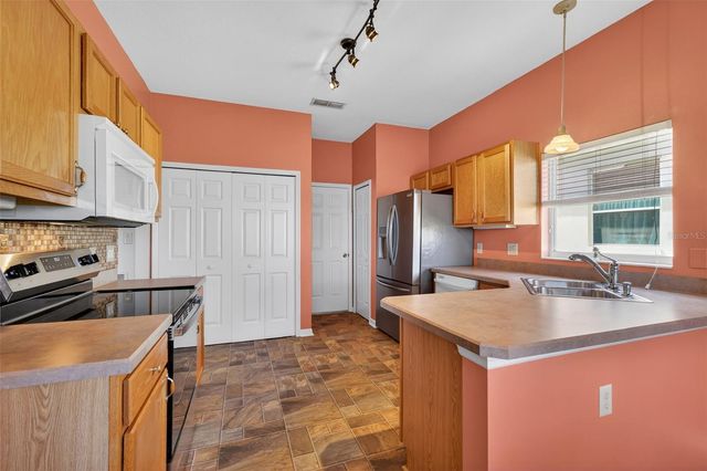 5024 LONG MEADOW DRIVE, Leesburg, FL 34748