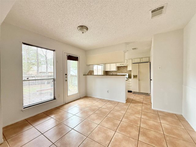 6 Maywind Court, The Woodlands, TX 77381