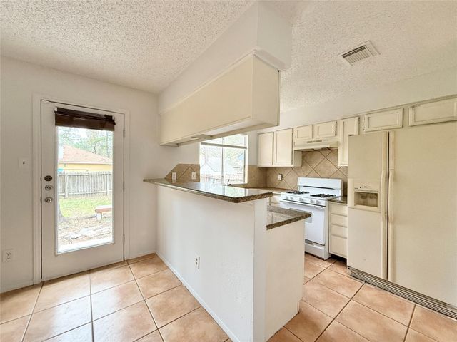 6 Maywind Court, The Woodlands, TX 77381