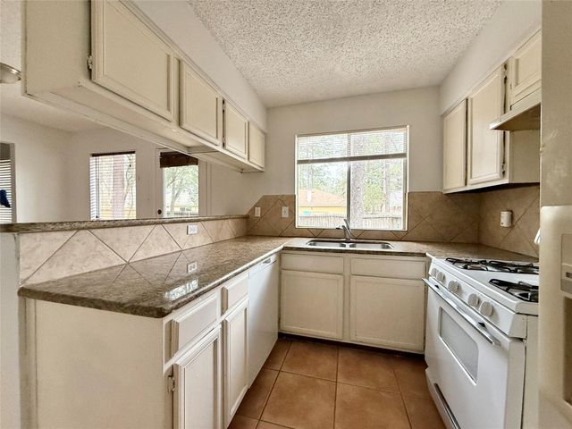 6 Maywind Court, The Woodlands, TX 77381