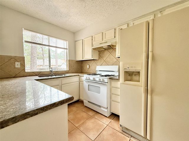 6 Maywind Court, The Woodlands, TX 77381