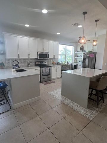 180 Seminole Lakes Drive, Royal Palm Beach, FL 33411