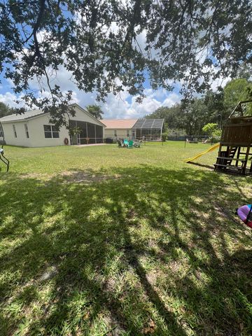 180 Seminole Lakes Drive, Royal Palm Beach, FL 33411