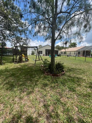 180 Seminole Lakes Drive, Royal Palm Beach, FL 33411