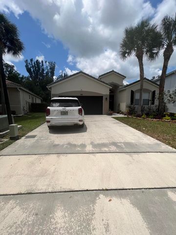 180 Seminole Lakes Drive, Royal Palm Beach, FL 33411