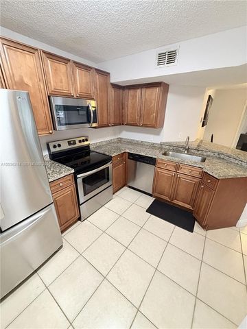 8741 Wiles Road 204, Coral Springs, FL 33067