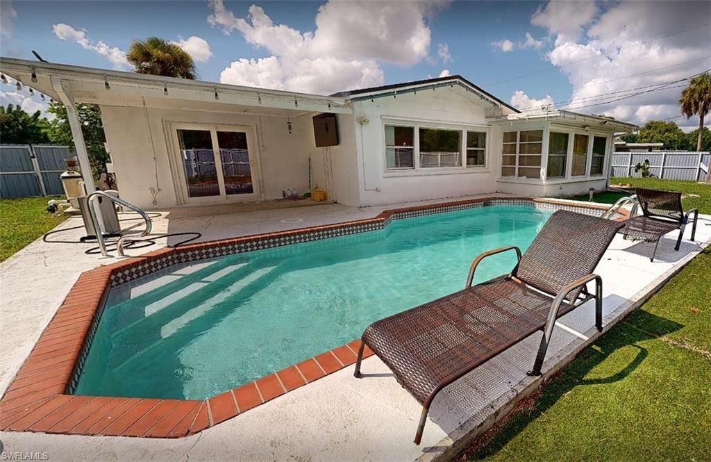 129 E Lake DR, LEHIGH ACRES, FL 33936 — exterior