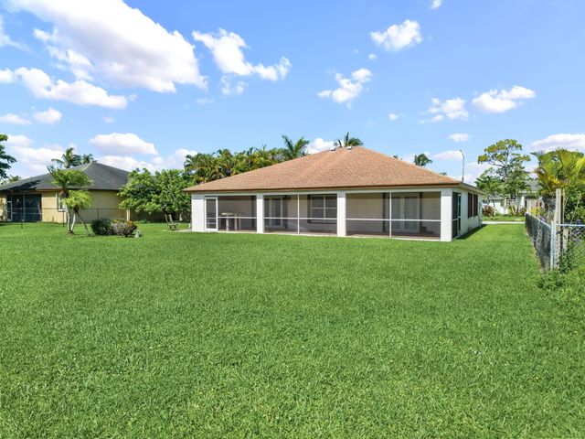 111 Meadow Woode Drive, Royal Palm Beach, FL 33411