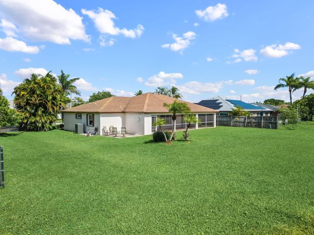 111 Meadow Woode Drive, Royal Palm Beach, FL 33411