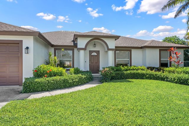 111 Meadow Woode Drive, Royal Palm Beach, FL 33411