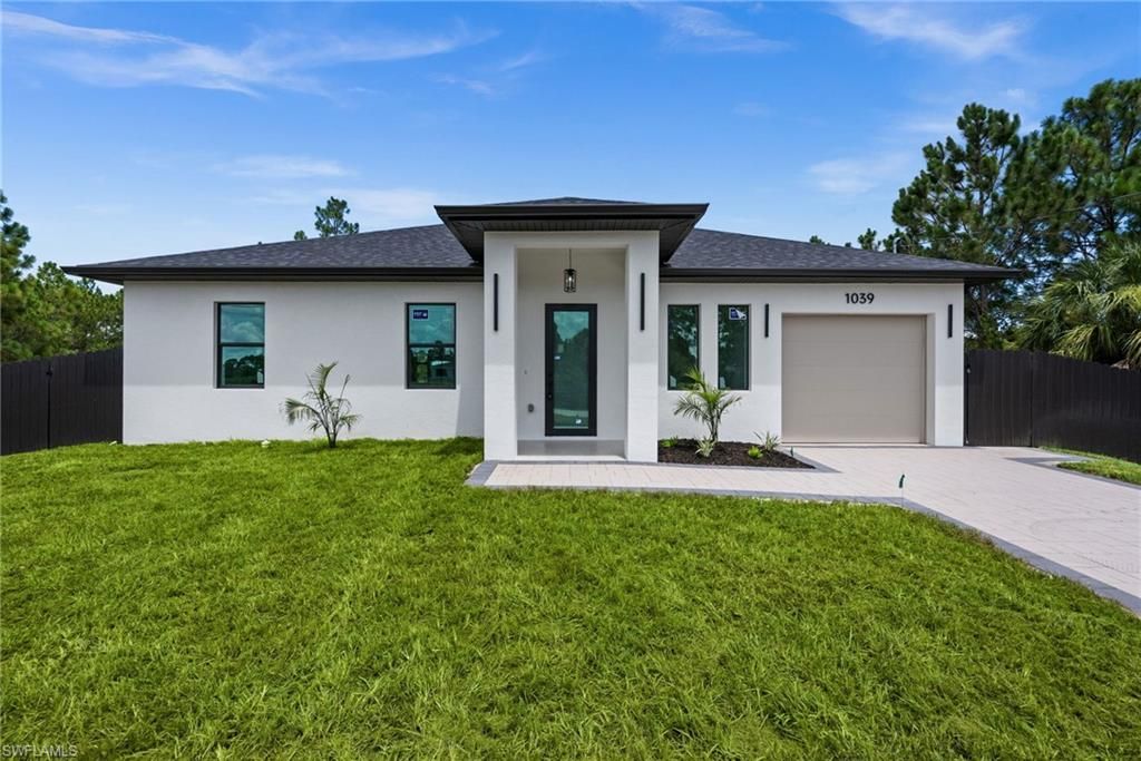 1039 Bassinger AVE S, LEHIGH ACRES, FL 33974 — exterior