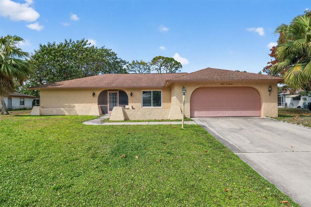 Image 2 of property listing at 307 MAPLE AVENUE N, Lehigh Acres, FL 33936