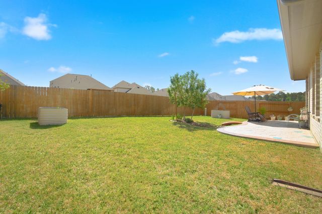 1409 Northwood Bluff Lane, Pinehurst, TX 77362