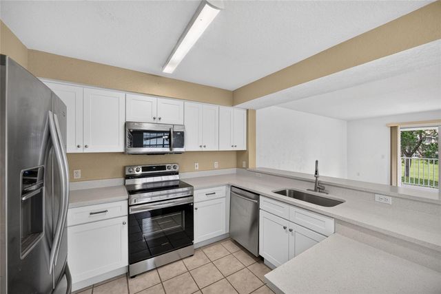 14013 FAIRWAY ISLAND DRIVE 428, Orlando, FL 32837