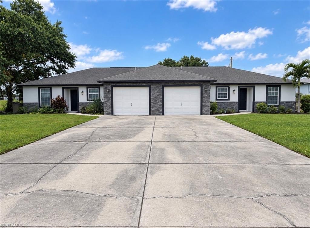 704 / 706 Gretchen AVE S, LEHIGH ACRES, FL 33973 — exterior