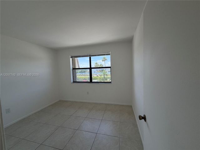 411 NW 100th Place 201, Pembroke Pines, FL 33024