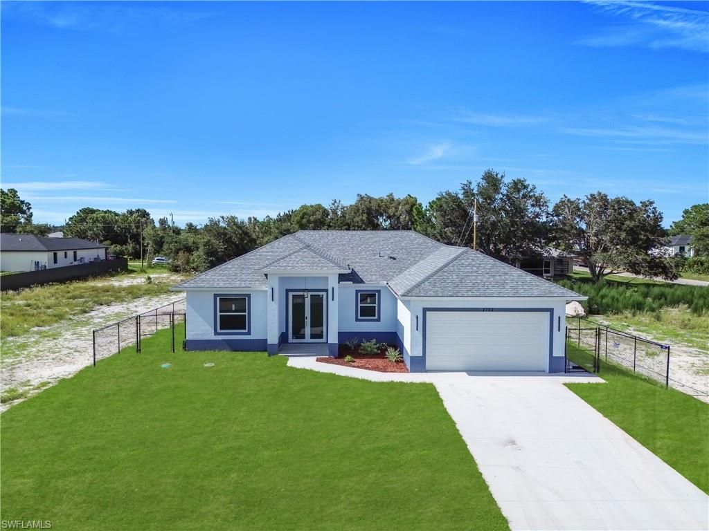 2702 30th ST SW, LEHIGH ACRES, FL 33976 — exterior