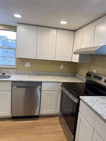 6062 AMBERLY AVENUE F53, Orlando, FL 32822