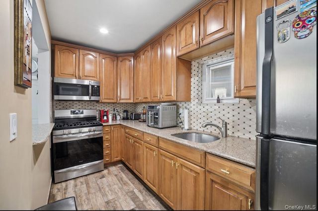 76-04 68th Avenue, Middle Village, NY 11379