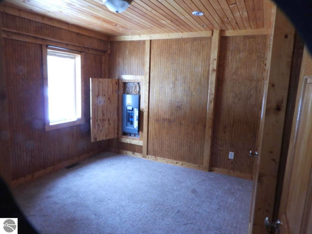 Image 6 of property listing at 7861 N Bass Lake Road, Irons, MI 49644