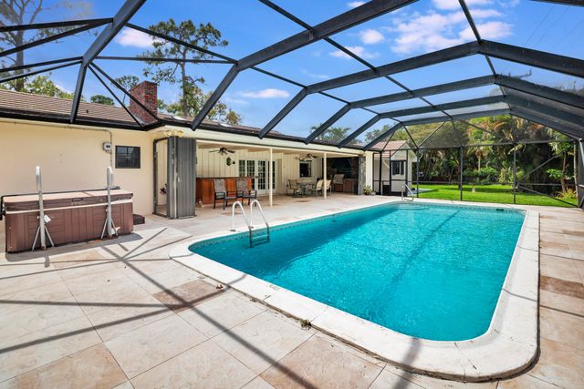 320 N Country Club Drive, Atlantis, FL 33462