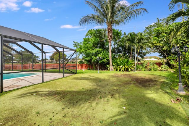 320 N Country Club Drive, Atlantis, FL 33462