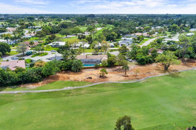 320 N Country Club Drive, Atlantis, FL 33462