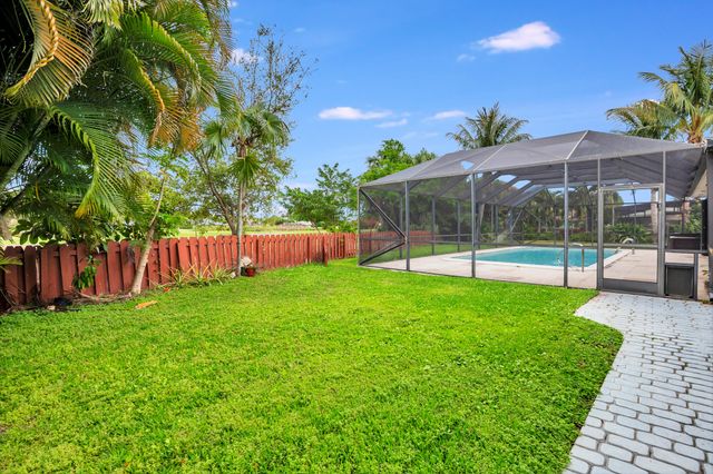 320 N Country Club Drive, Atlantis, FL 33462